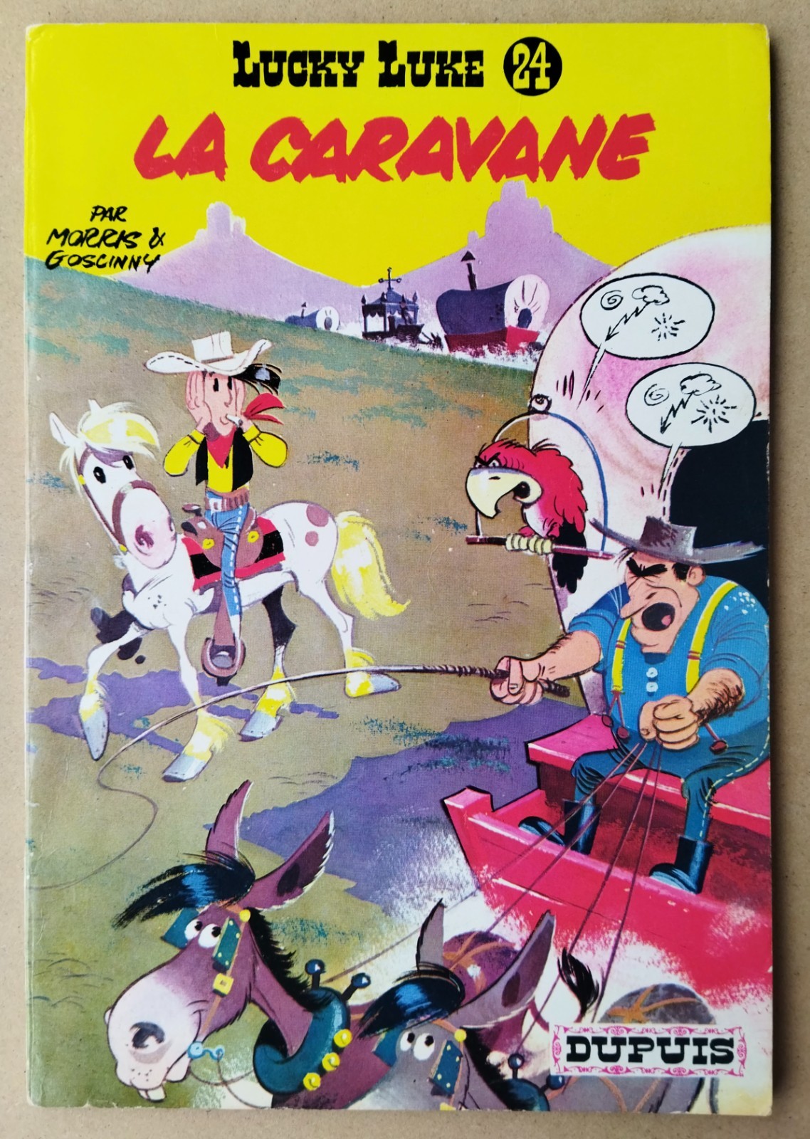MORRIS  -- LUCKY LUKE (24). LA CARAVANE --  EO 1964. PROCHE NEUF